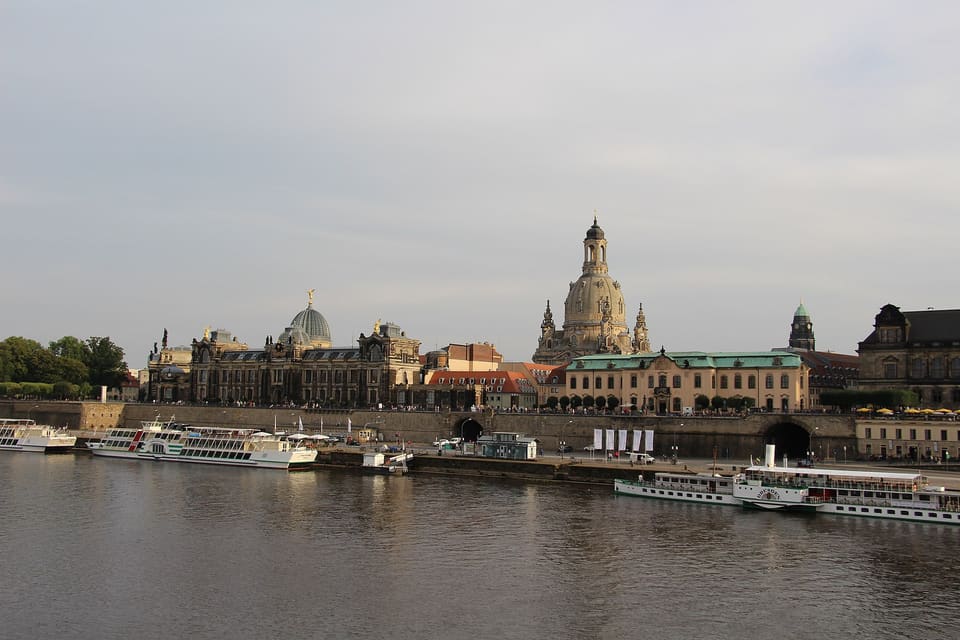 Brühl's Terrace seen from across the Elbe, a long wall above the river quay with the Kunstakademie's dome and the Frauenkirche rising behind and steamers moored in front.